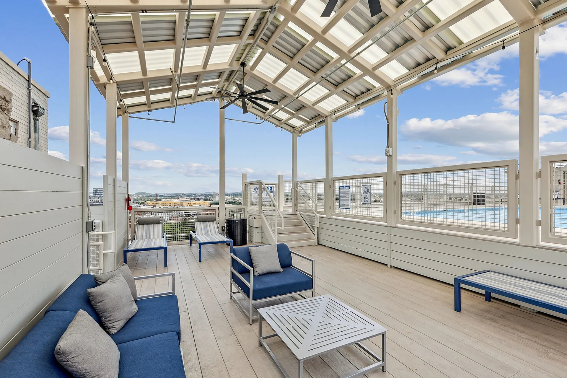 Inviting rooftop lounge with stylish seating and scenic city views, perfect for relaxing or entertaining.