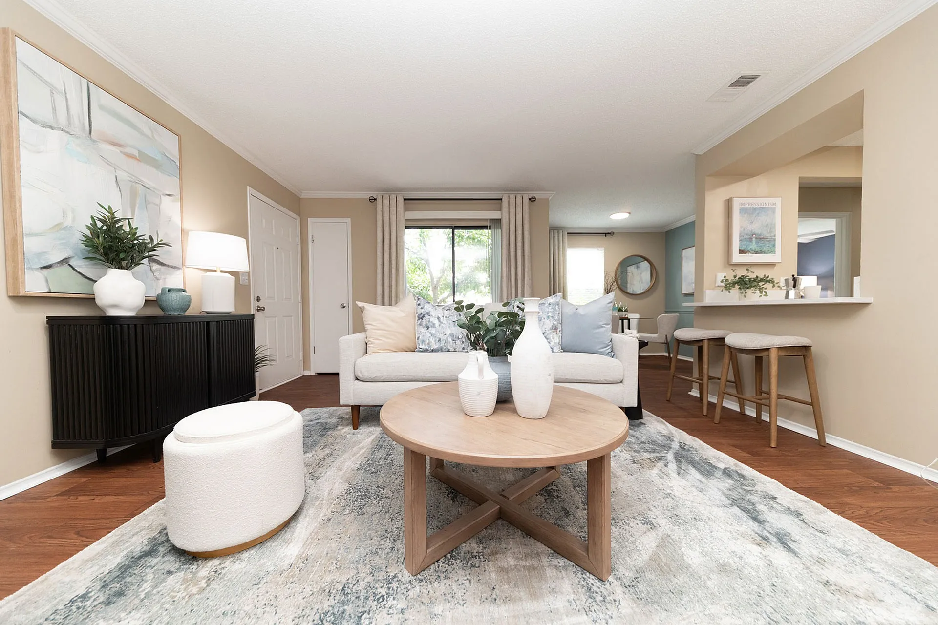 Inviting living room with elegant decor, cozy seating, and natural light, perfect for relaxation and social gatherings.
