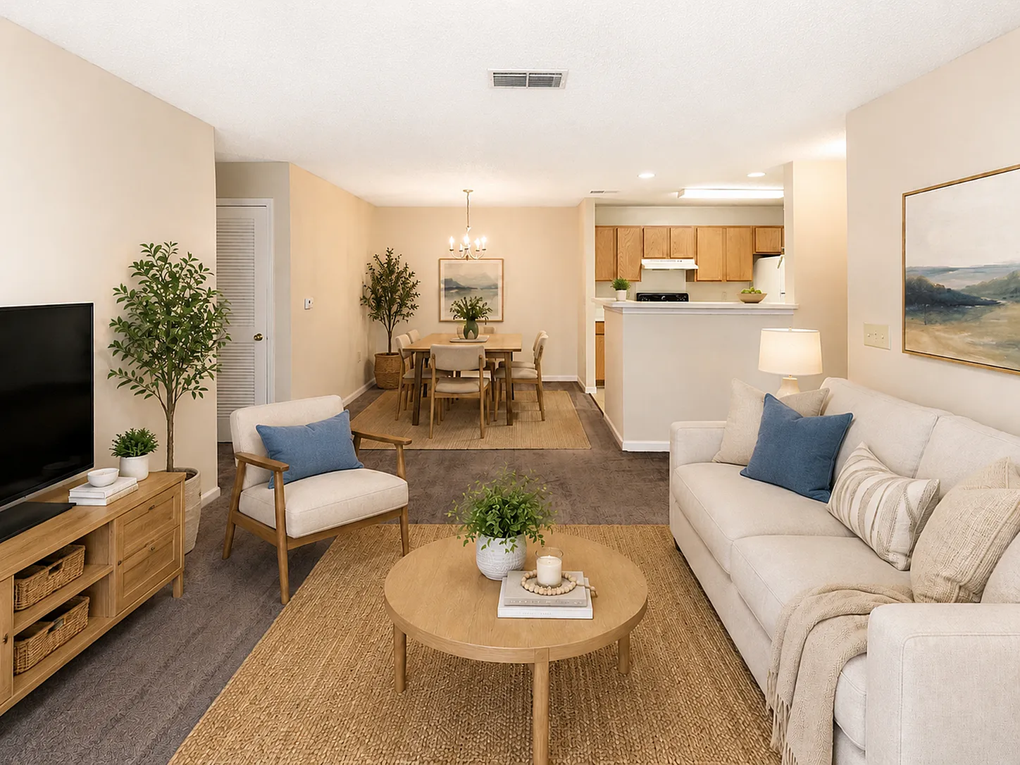Inviting living room with cozy seating, elegant dining area, and modern open kitchen in a stylish apartment.