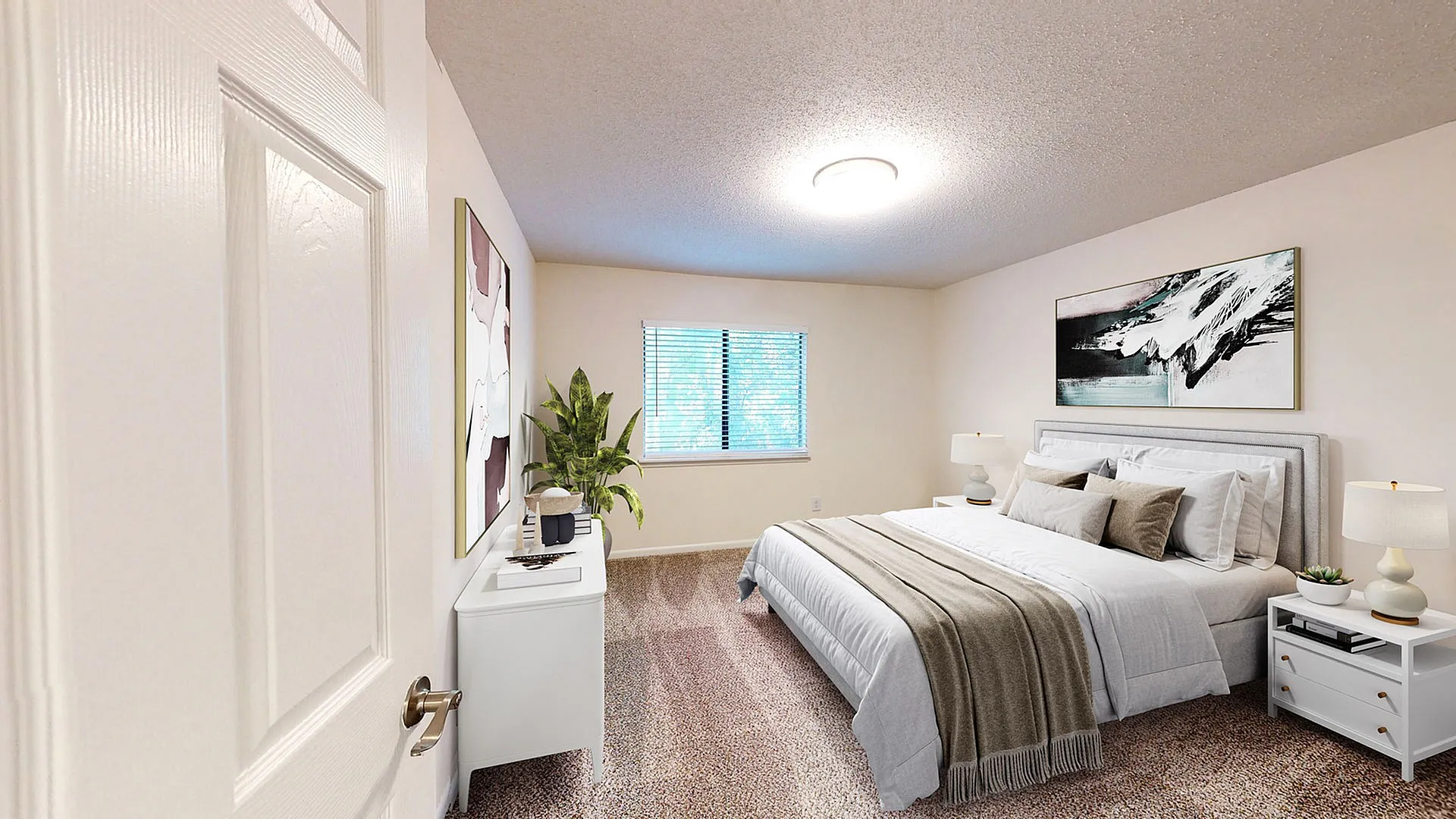Inviting bedroom with a plush bed, elegant decor, and abundant natural light from a large window.