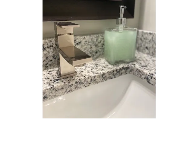Granite counter tops in kitchen and bathroom(s)