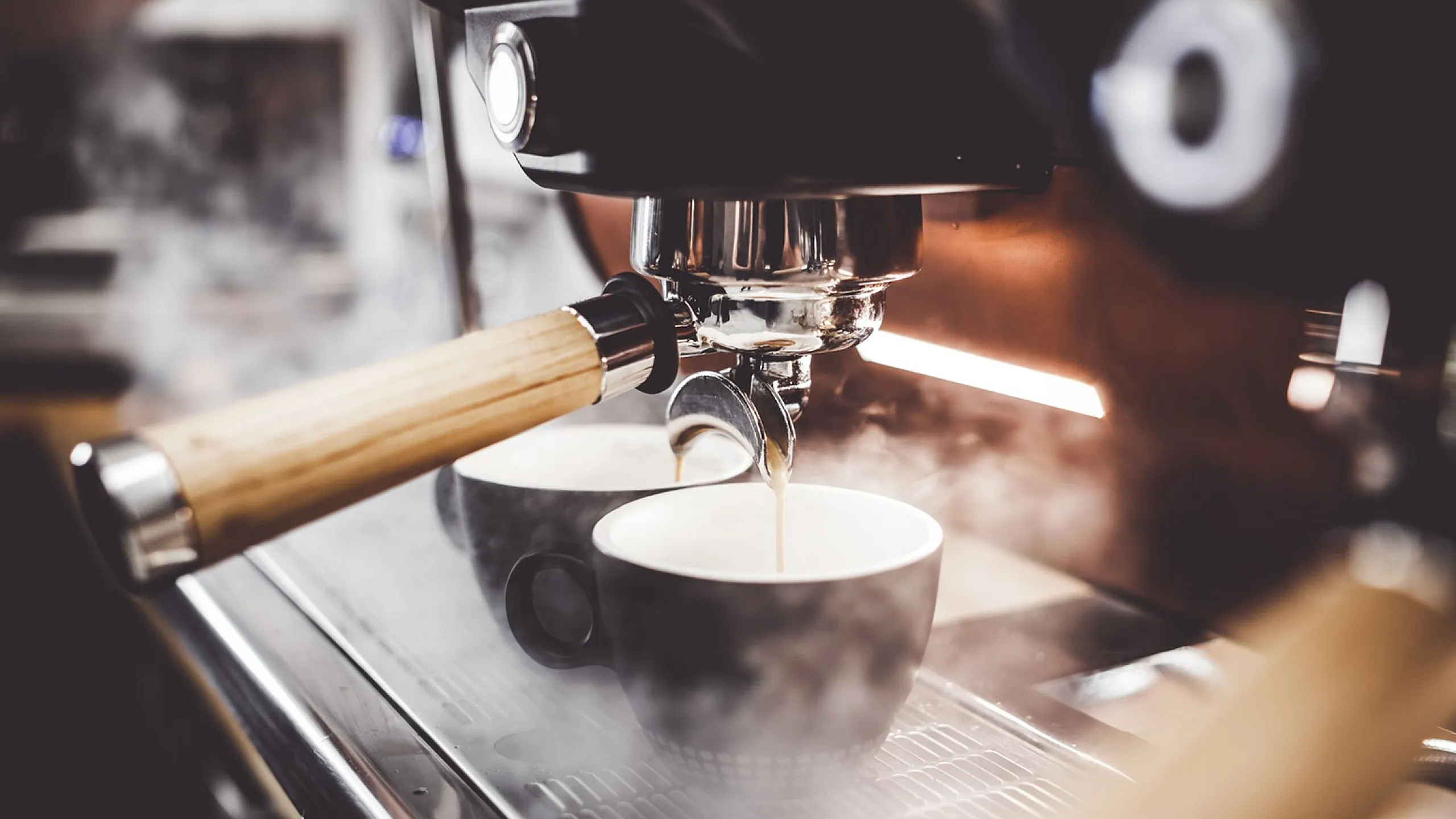 Elegant espresso machine brewing fresh coffee into stylish cups, perfect for morning routines.