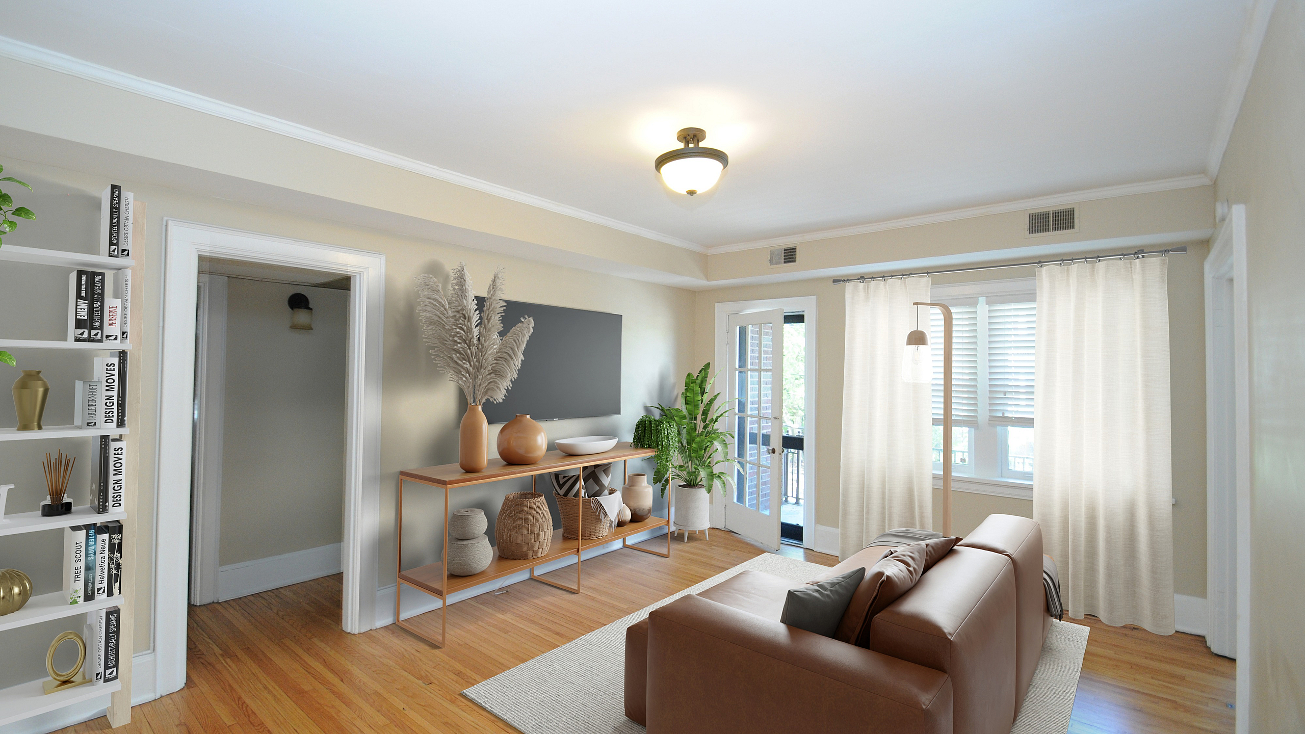 Elegant living room with a stylish leather sofa, chic decor, and abundant natural light from large windows. Modern, inviting space with hardwood floors and a minimalist console table.