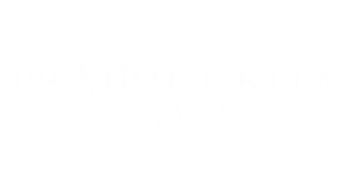Elegant Prairie Creek Estates logo in stylish typography.