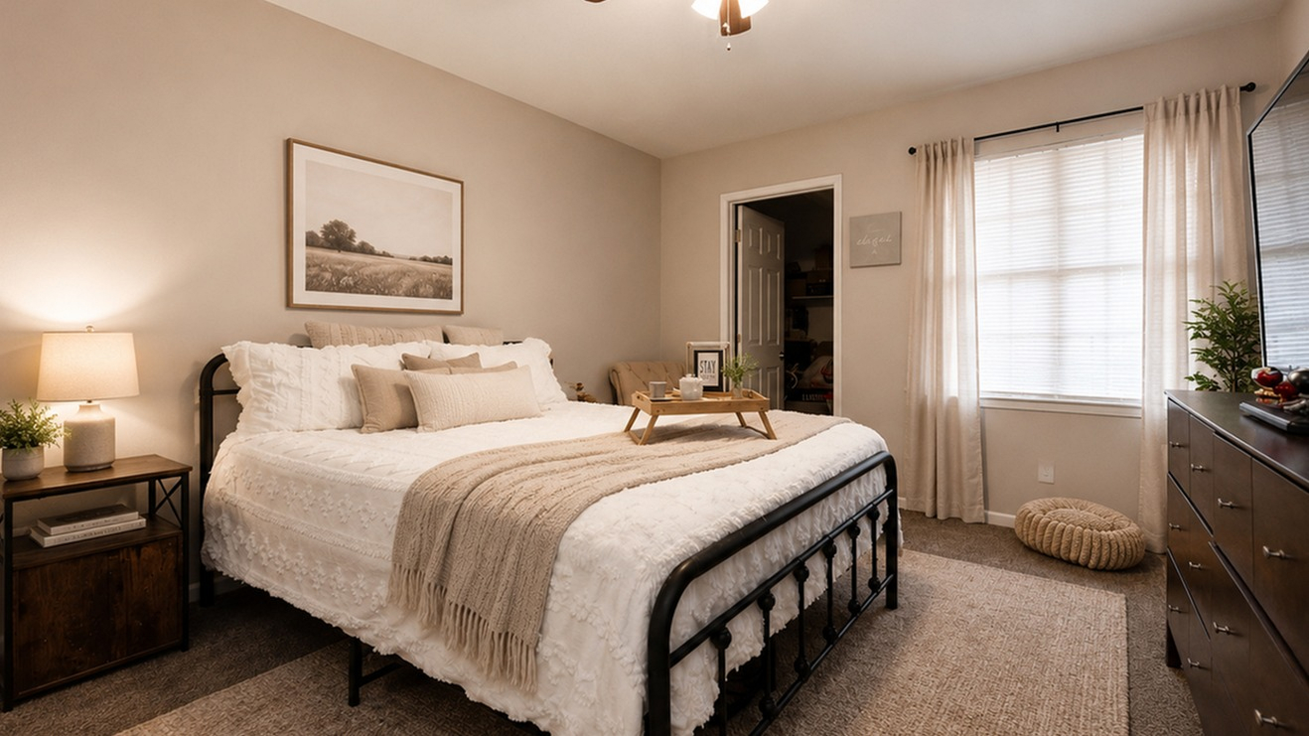 Inviting bedroom with cozy decor, featuring a plush bed, elegant lighting, and warm earthy tones.