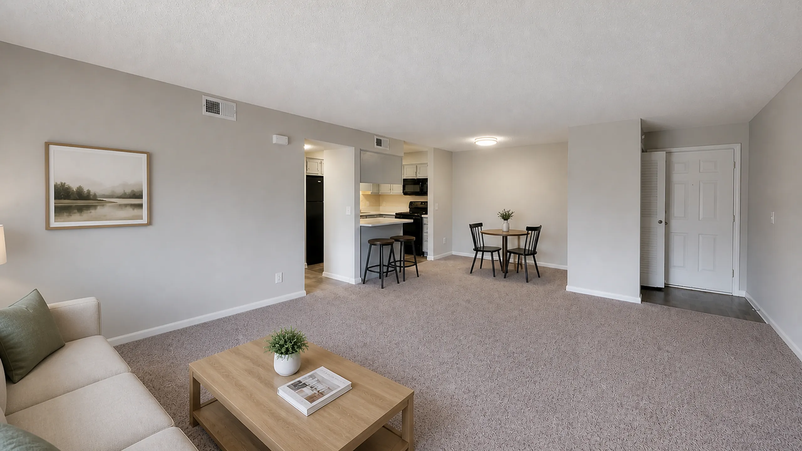 Inviting open-concept living space with cozy seating, modern kitchen, and stylish dining area.