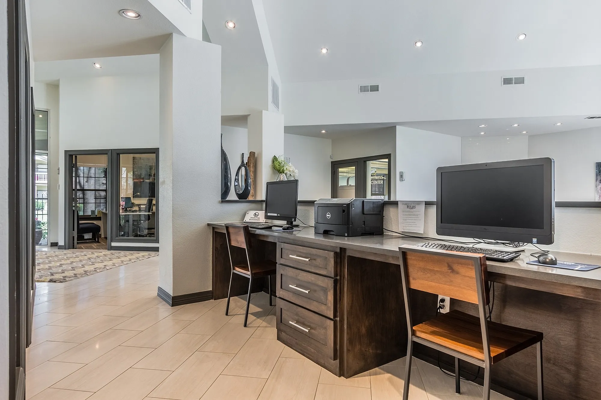 Elegant office space with modern decor, spacious desk, and comfortable seating, perfect for productivity.