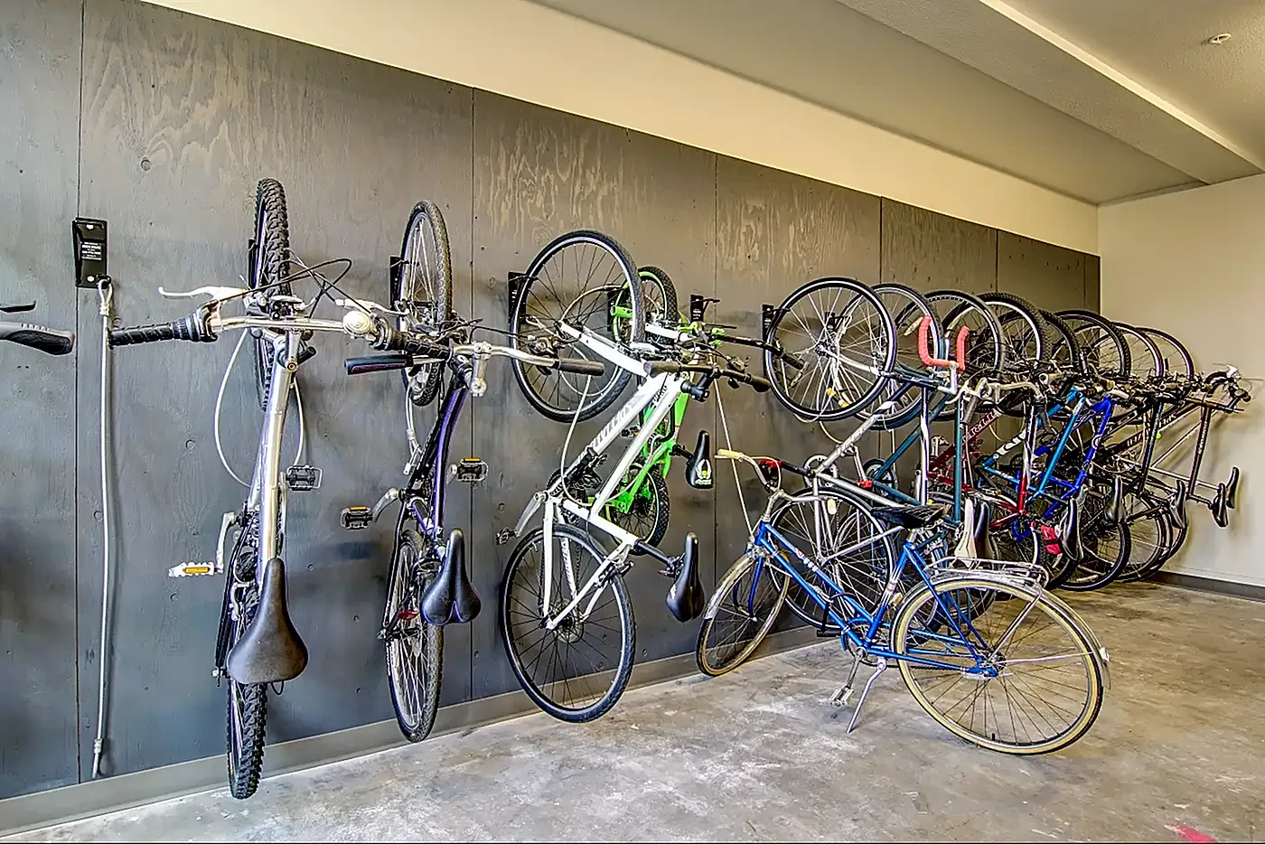 Modern apartment bike storage showcasing a sleek wall-mounted system with multiple bicycles, highlighting convenience and style.