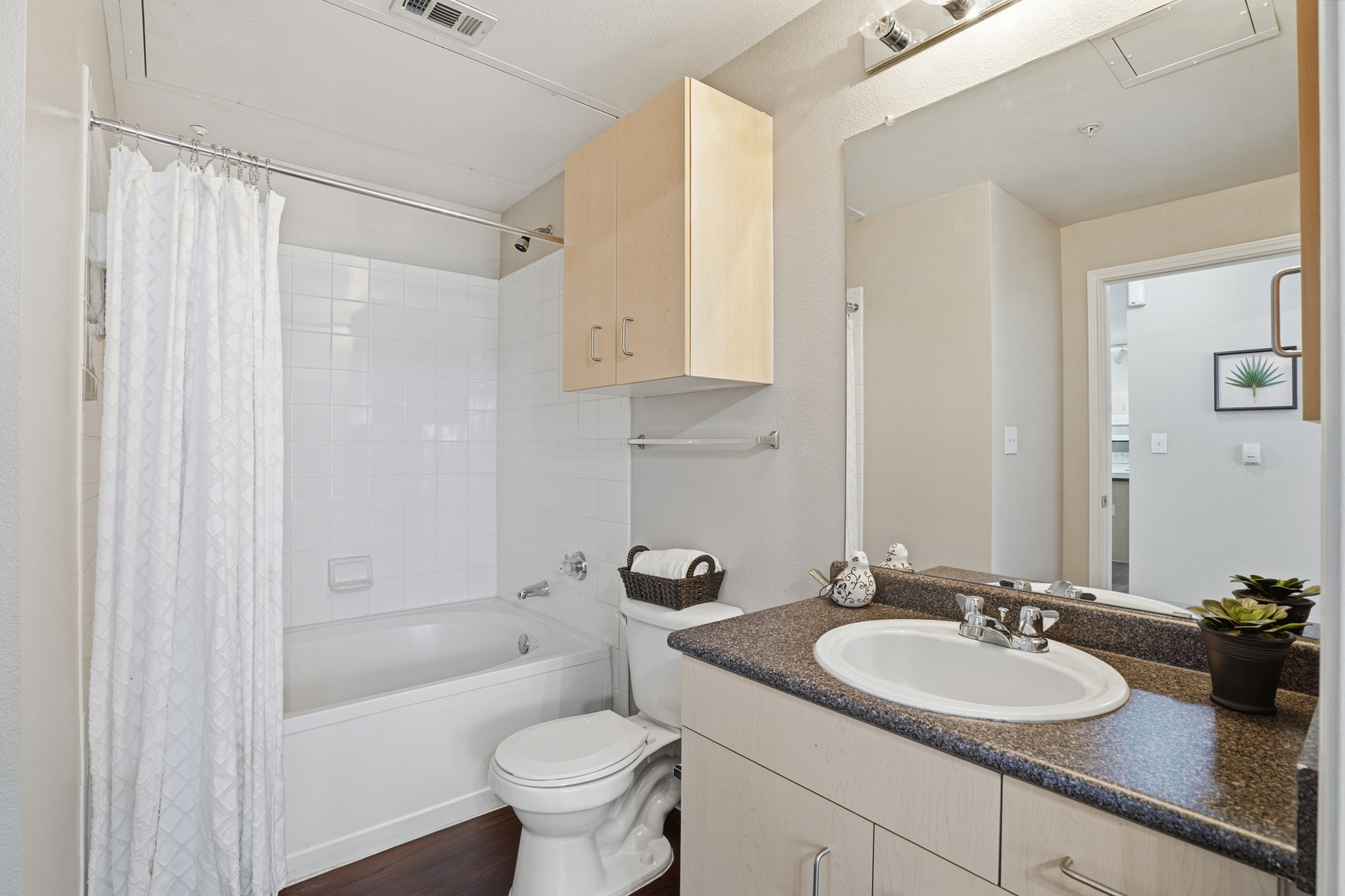 Modern bathroom with elegant fixtures, a relaxing bathtub, and stylish decor, perfect for a tranquil retreat.