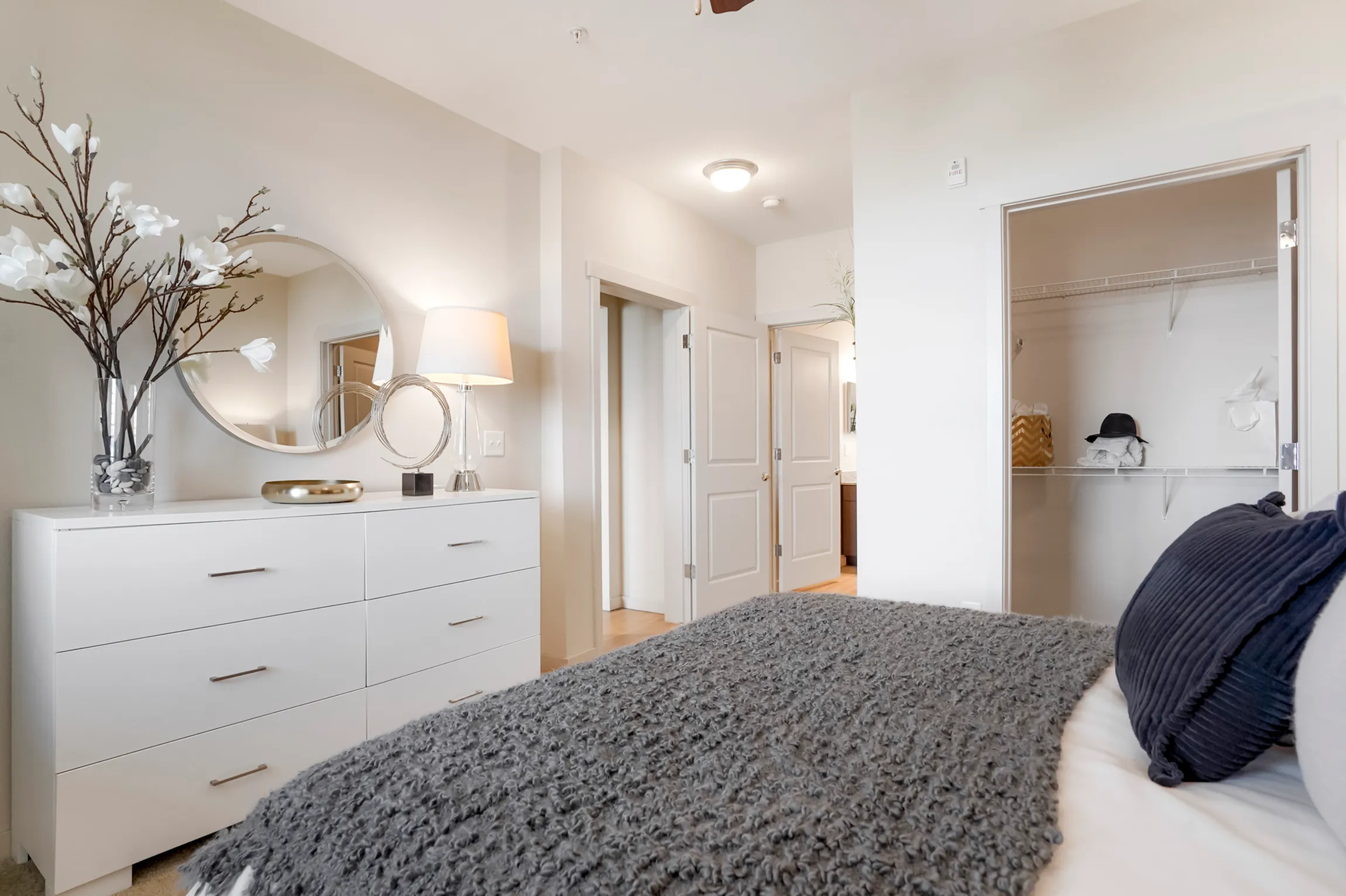 Spacious walk-in closet with organized shelving, perfect for storage and maximizing space.