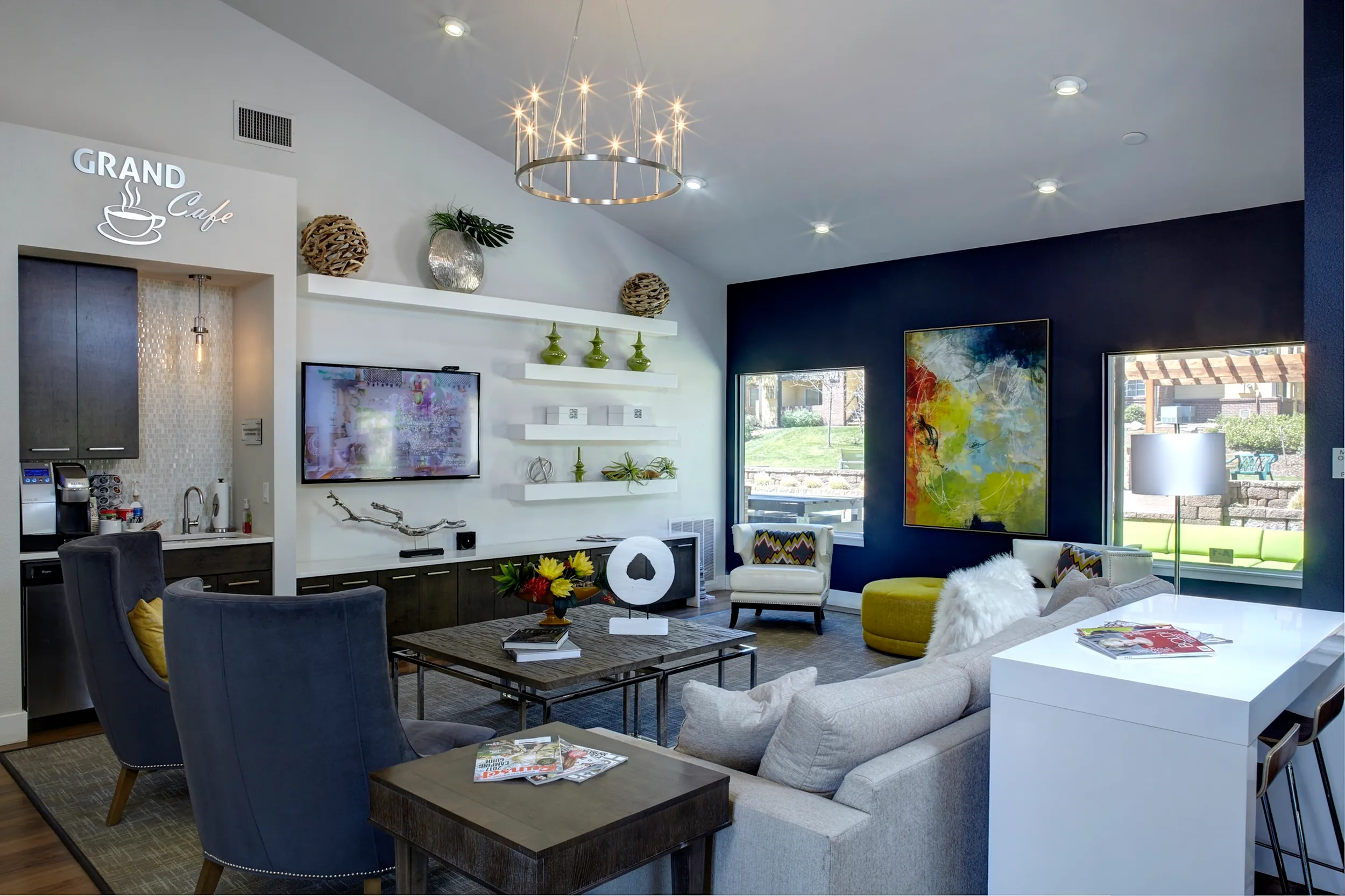 Chic lounge area with elegant furnishings, modern art, and a cozy coffee corner.