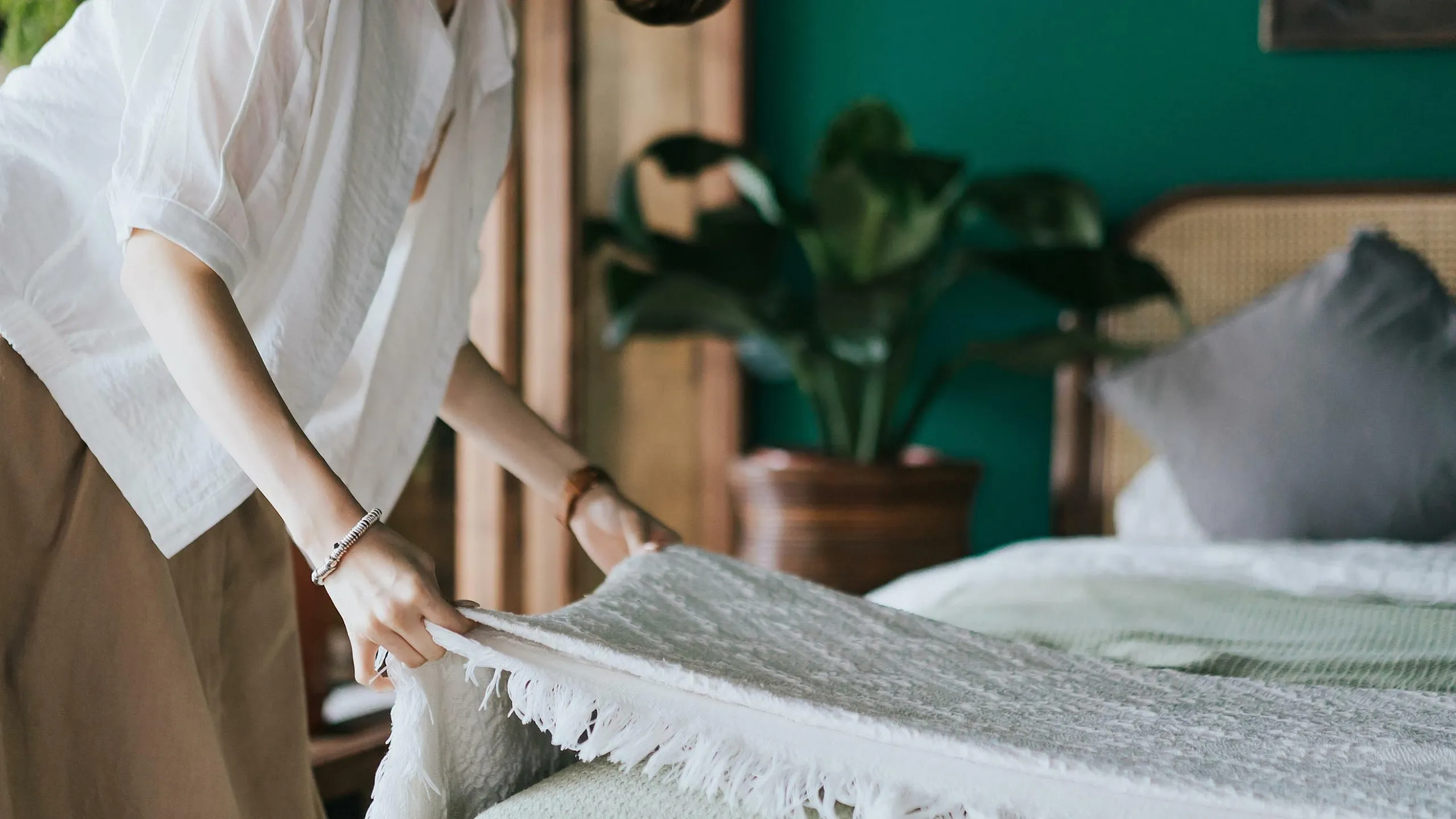 lady making bed