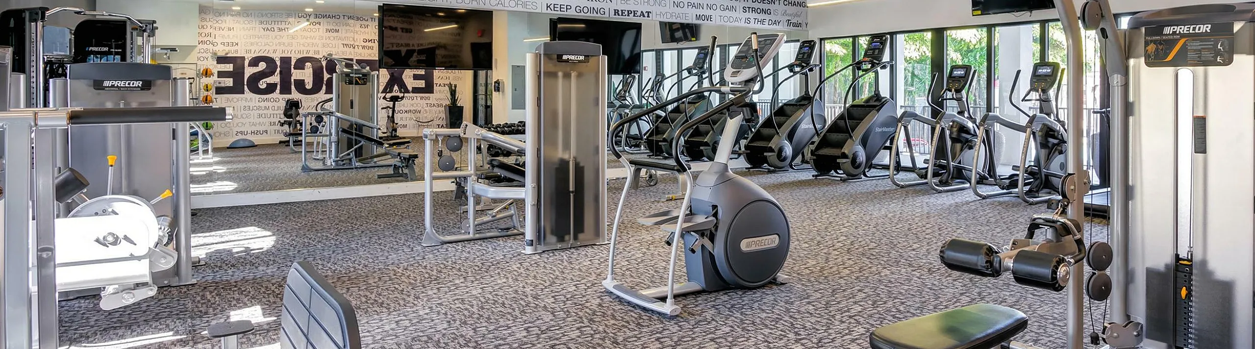 Elegant outdoor cabana with cozy wicker seating, lush greenery, and a tranquil ambiance for relaxation.