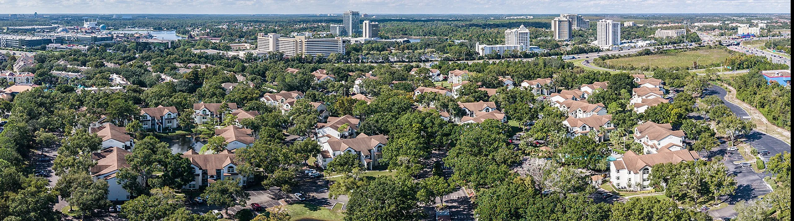 Aerial image of entire community showing buildings in the foreground and I-5 in the background