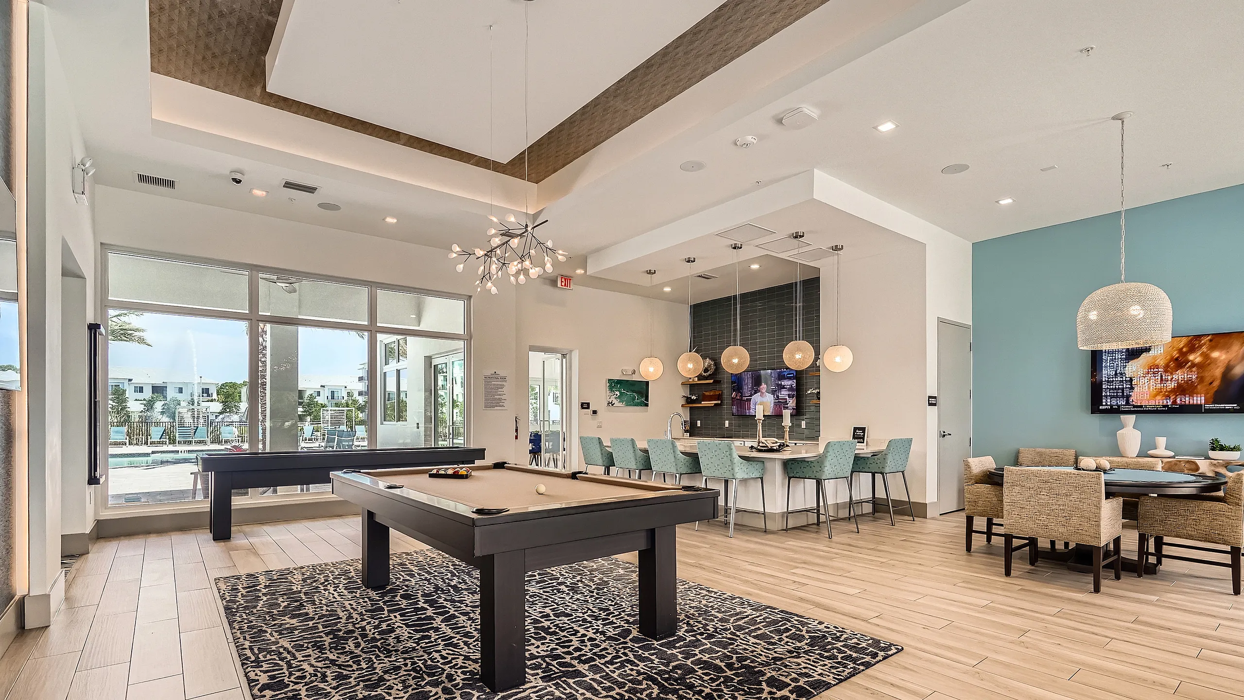 Clubhouse and game room with billiards cards table shuffleboard and kitchen