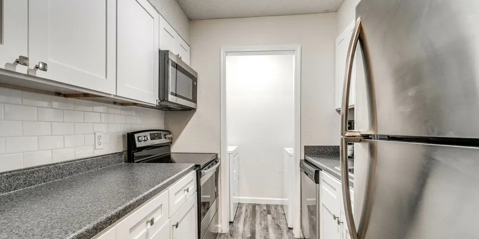 The Izzy Apartments Upgraded Kitchen Stainless Steel Appliances