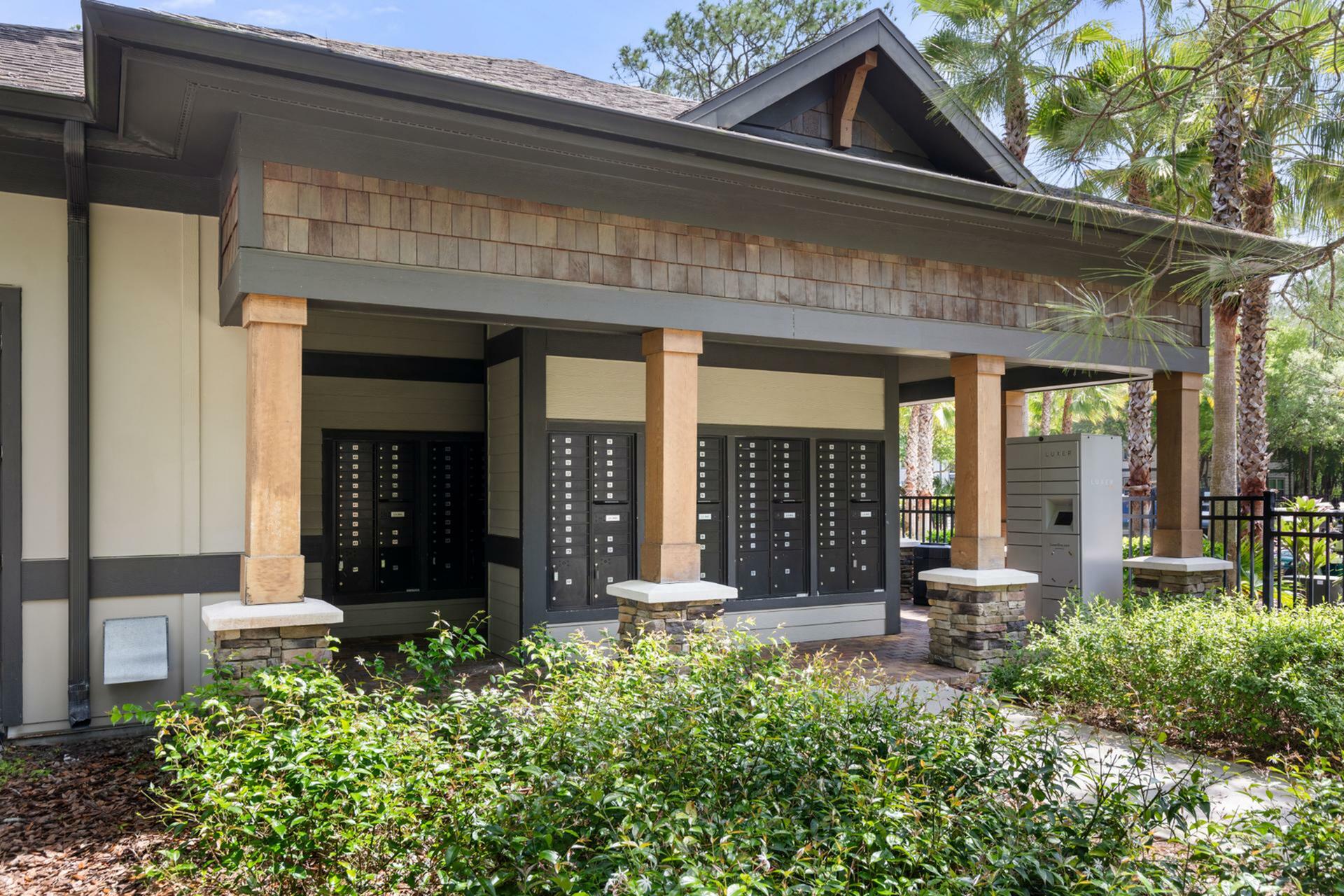 Charming outdoor mailing center with elegant design, featuring numerous mailboxes and lush greenery, perfect for a serene community environment.