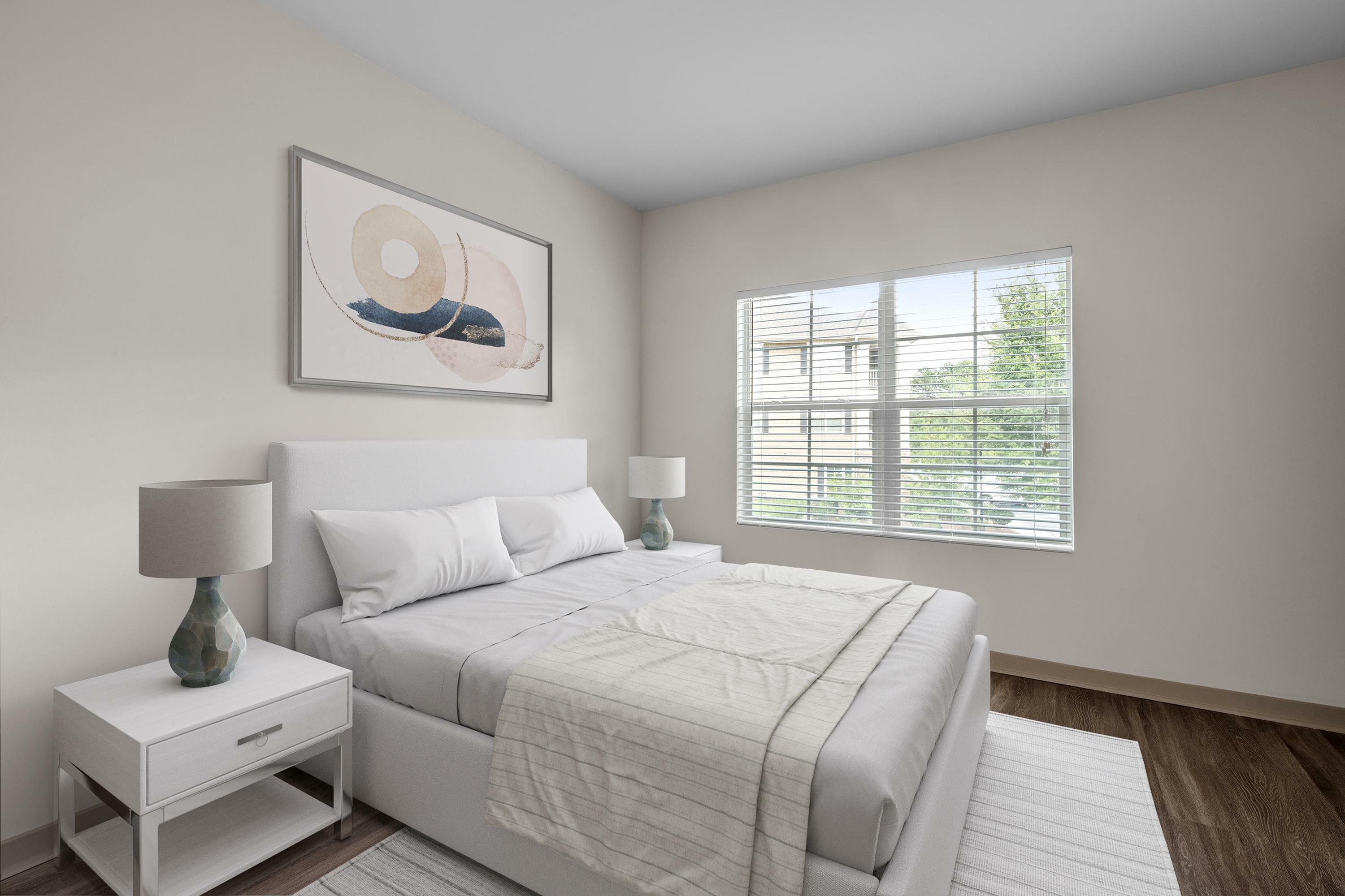 Bright and serene bedroom with a comfortable bed, modern decor, and large window offering a view of lush greenery.