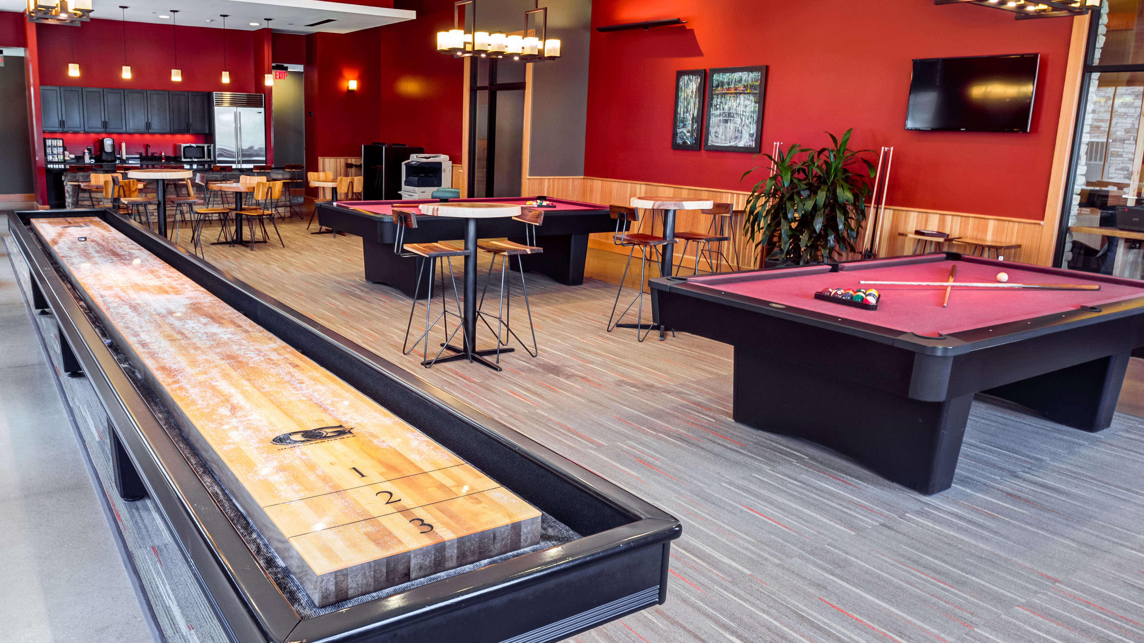 Image of Gaming Area featuring Full-Size Shuffleboard Table & Billiards Tables for The Heights at State College