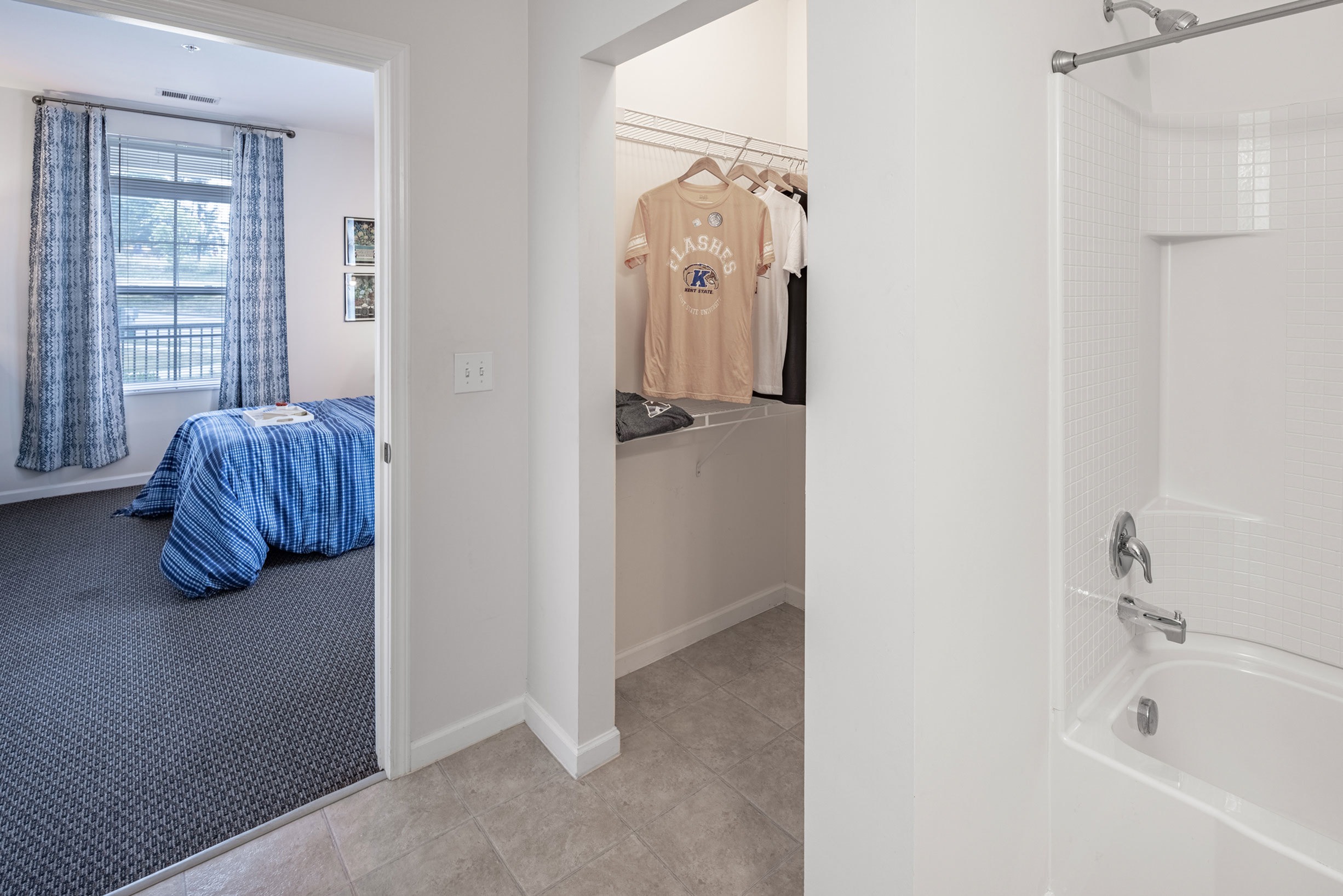 Model apartment bathroom with walk in closet inside