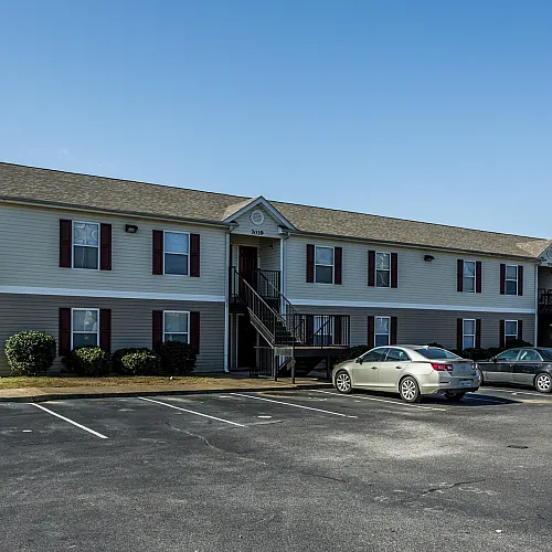 Wide view of buildings and parking lot at Countryside Village in Memphis, TN