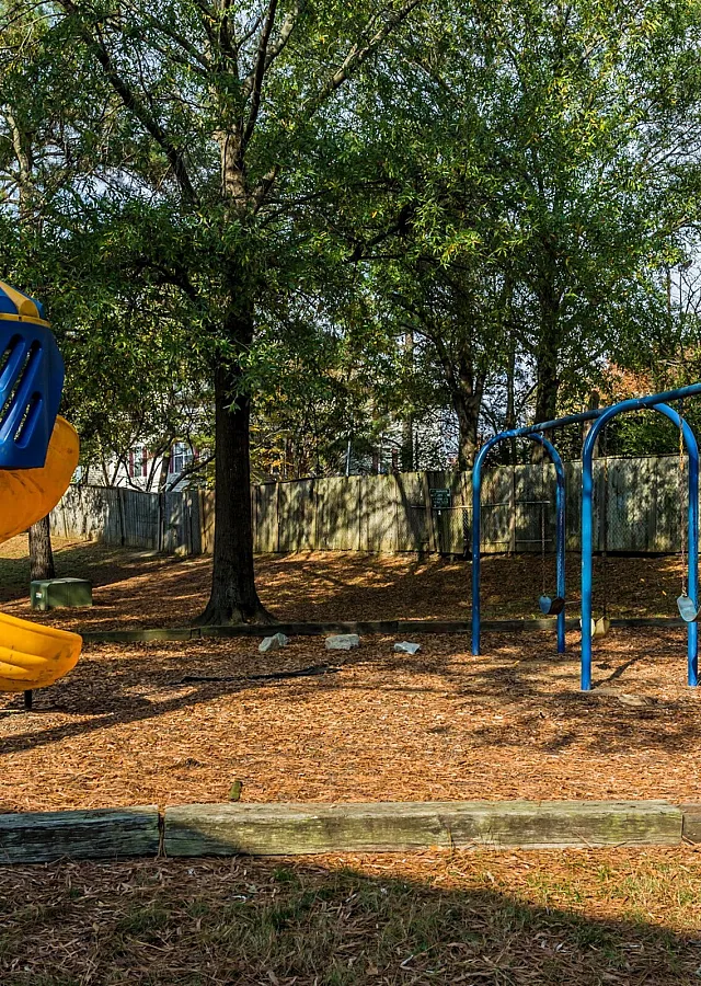 Playground with slides and swings at Hickory Forest in Memphis, TN