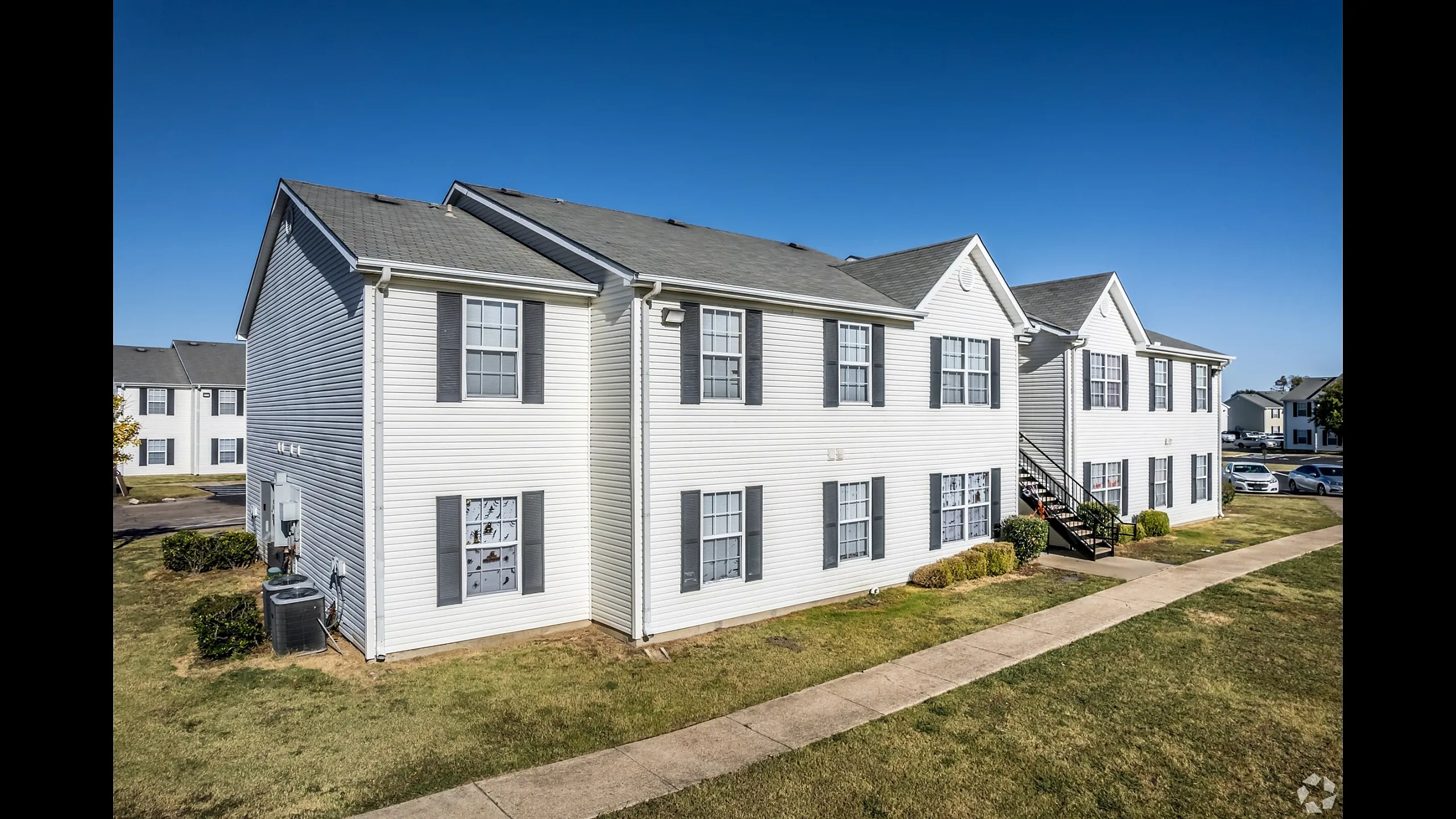 Front view of two-story apartment homes at Meadows West Memphis Apartments in West Memphis, AR