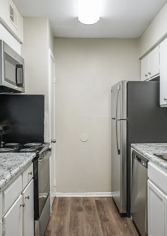 Updated kitchen with granite counters and stainless appliances at Trails at Northpointe in Jackson, MS