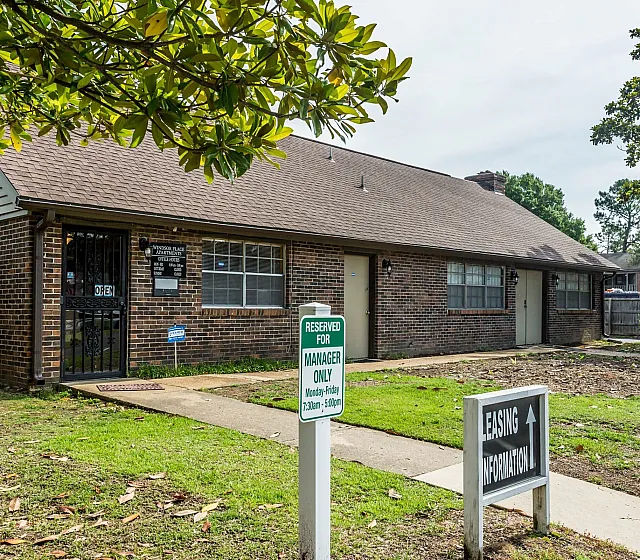 Brick leasing office with welcoming walkway at Windsor Place Apartments in Memphis, TN