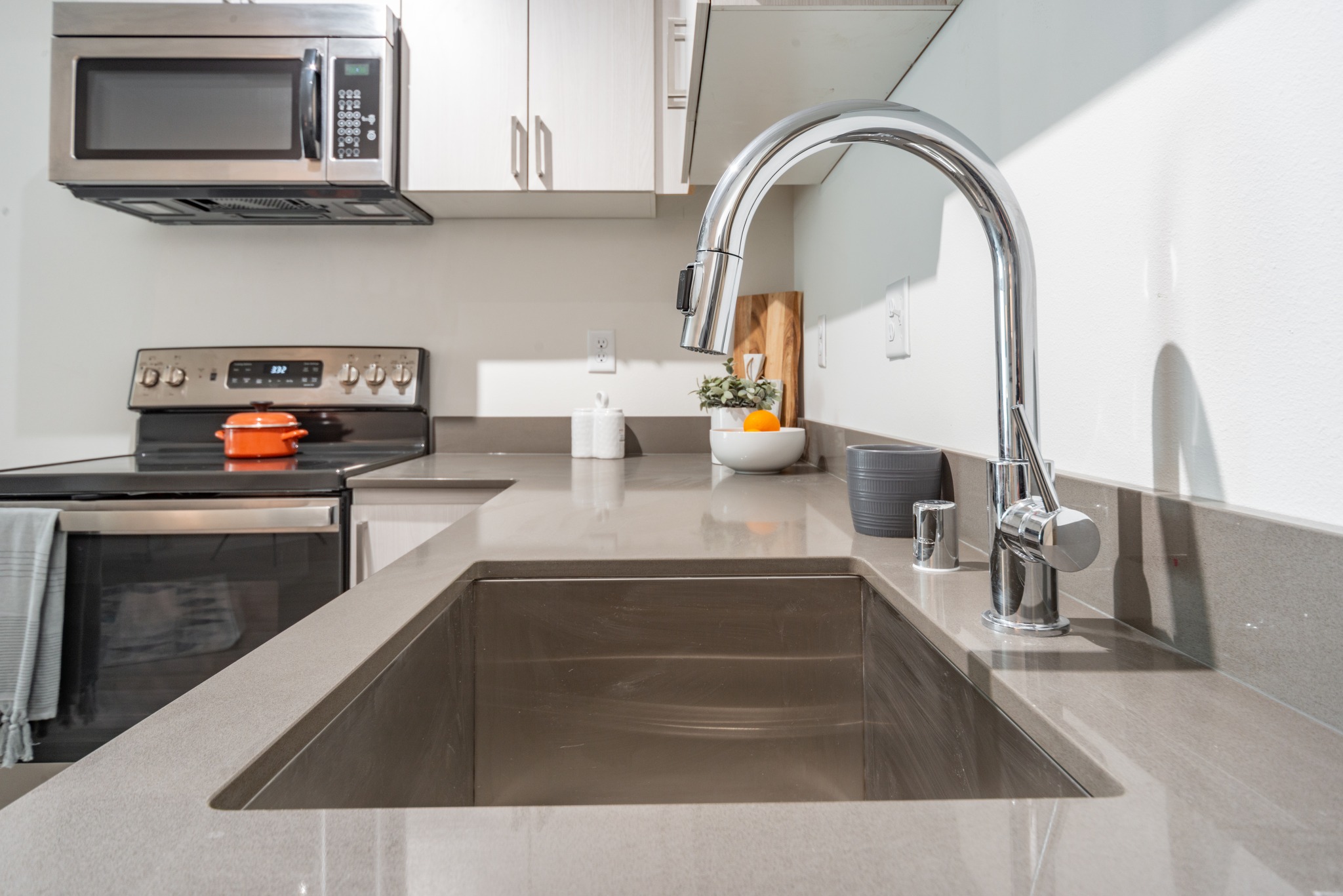 Deep stainless steel sinks with kitchen faucet with pull down spray head