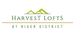 Modern logo for Harvest Lofts at River District, featuring stylized green mountains and elegant typography.