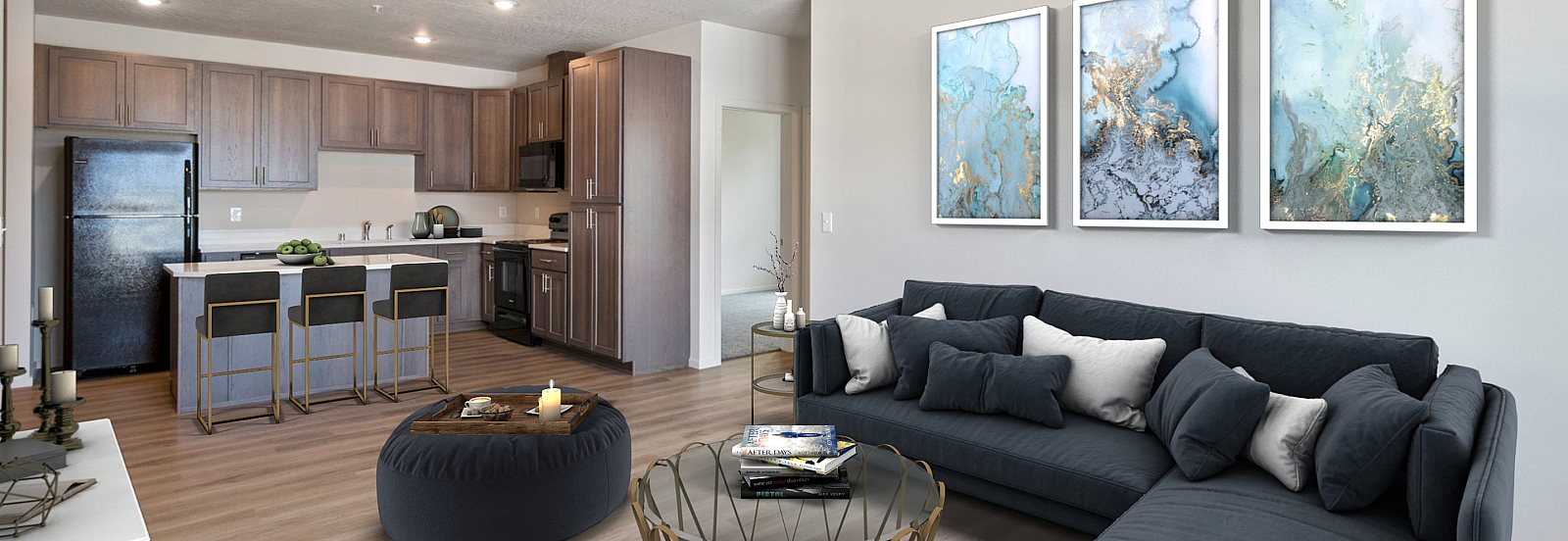 Modern open-concept living room and kitchen with sleek furnishings and stylish decor.