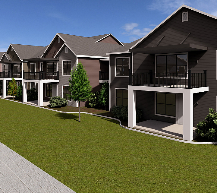 Charming row of elegant townhouses with spacious balconies and lush green surroundings under a clear blue sky.