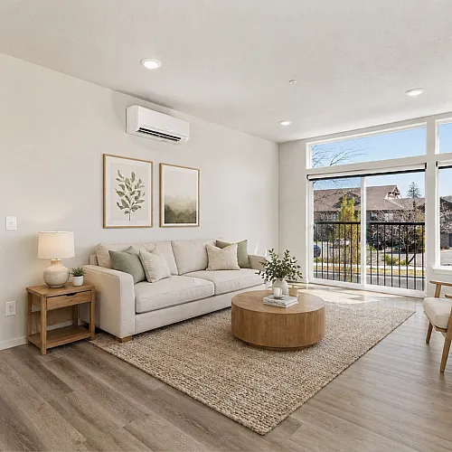 Bright, modern living room with large windows, contemporary decor, and stylish neutral furnishings, showcasing a relaxing ambiance.