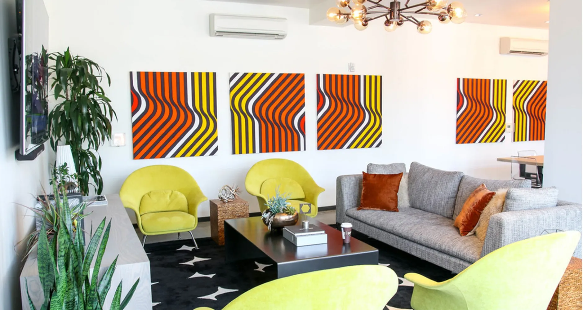 Community room with couch and large flat-screen TV for your enjoyment