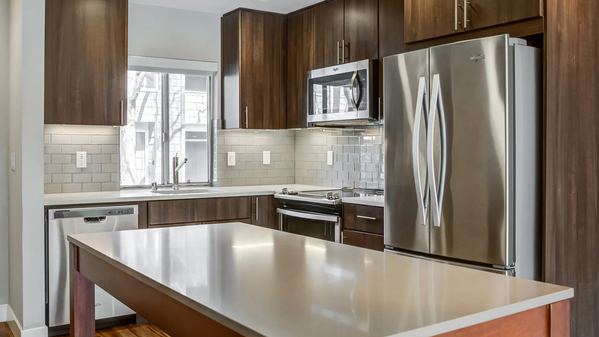 Renovated Kitchen with stainless steel appliances and back splash