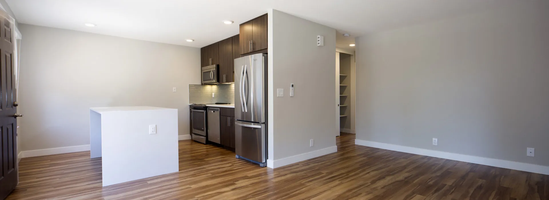 Renovated Living Room and Kitchen with stainless steel appliances