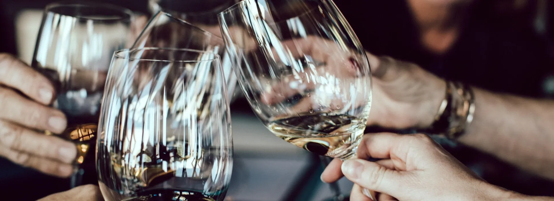 Friends clinking wine glasses