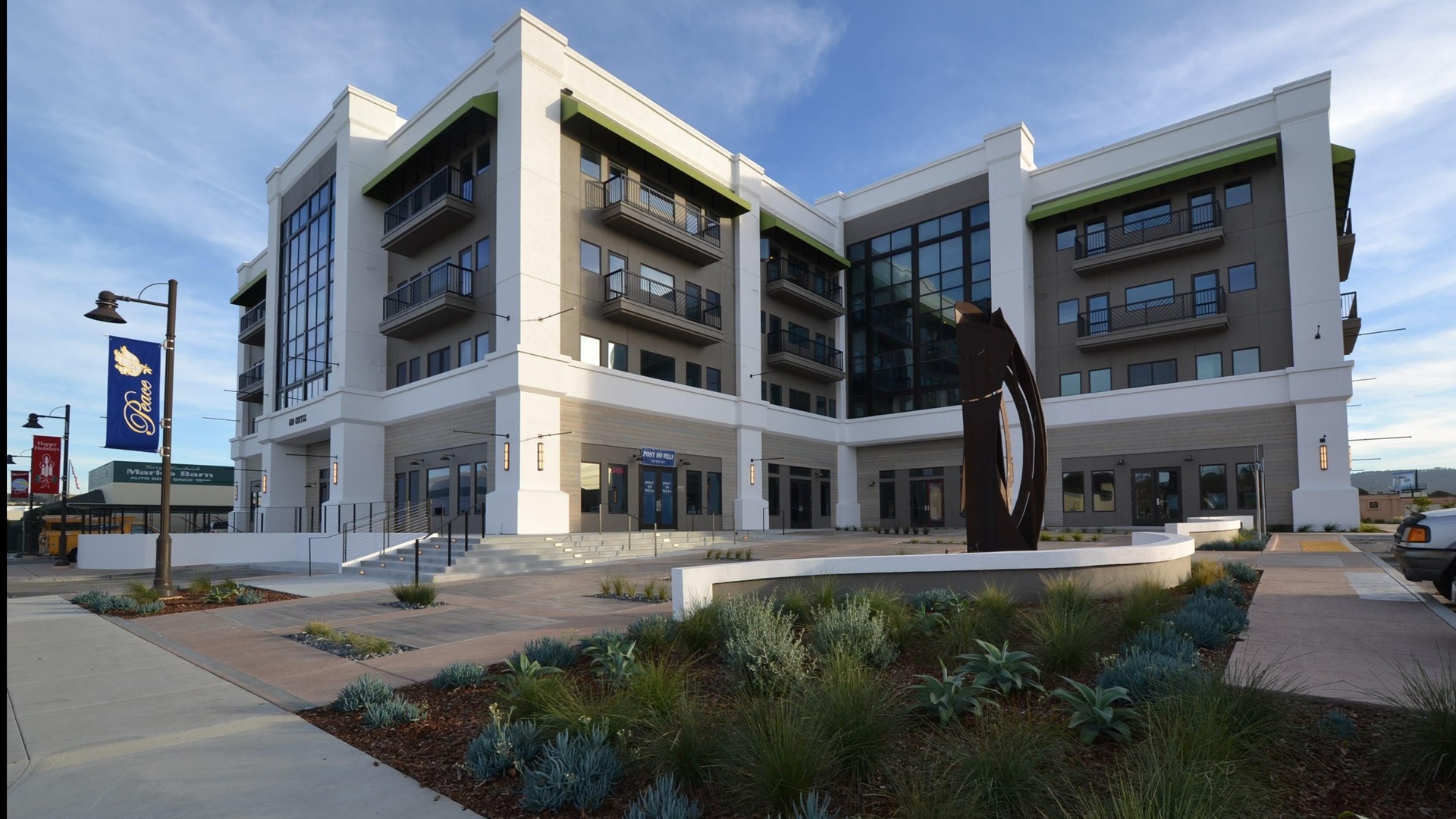 Exterior of The Independent with steel public art sculpture in foreground