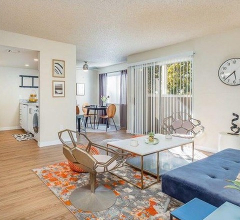 Living room with view of dining area and kitchen