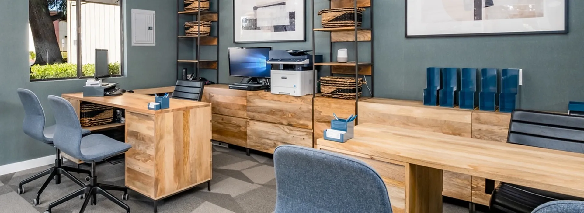 rental office interior with 2 wooden desks.