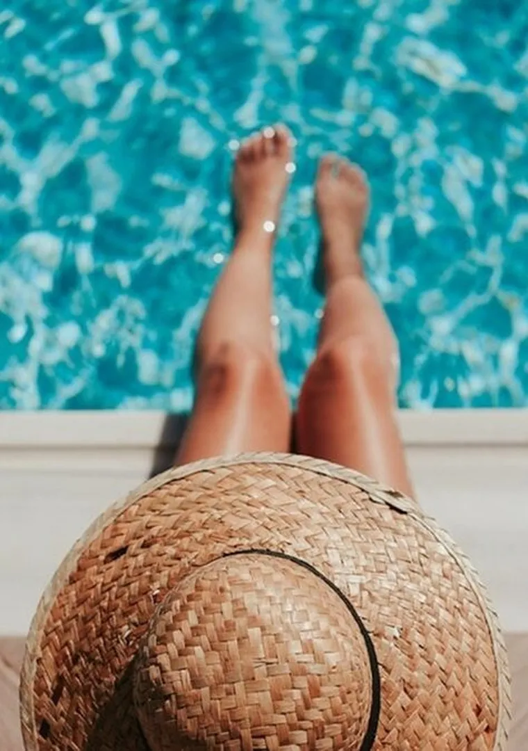 woman sitting at pool