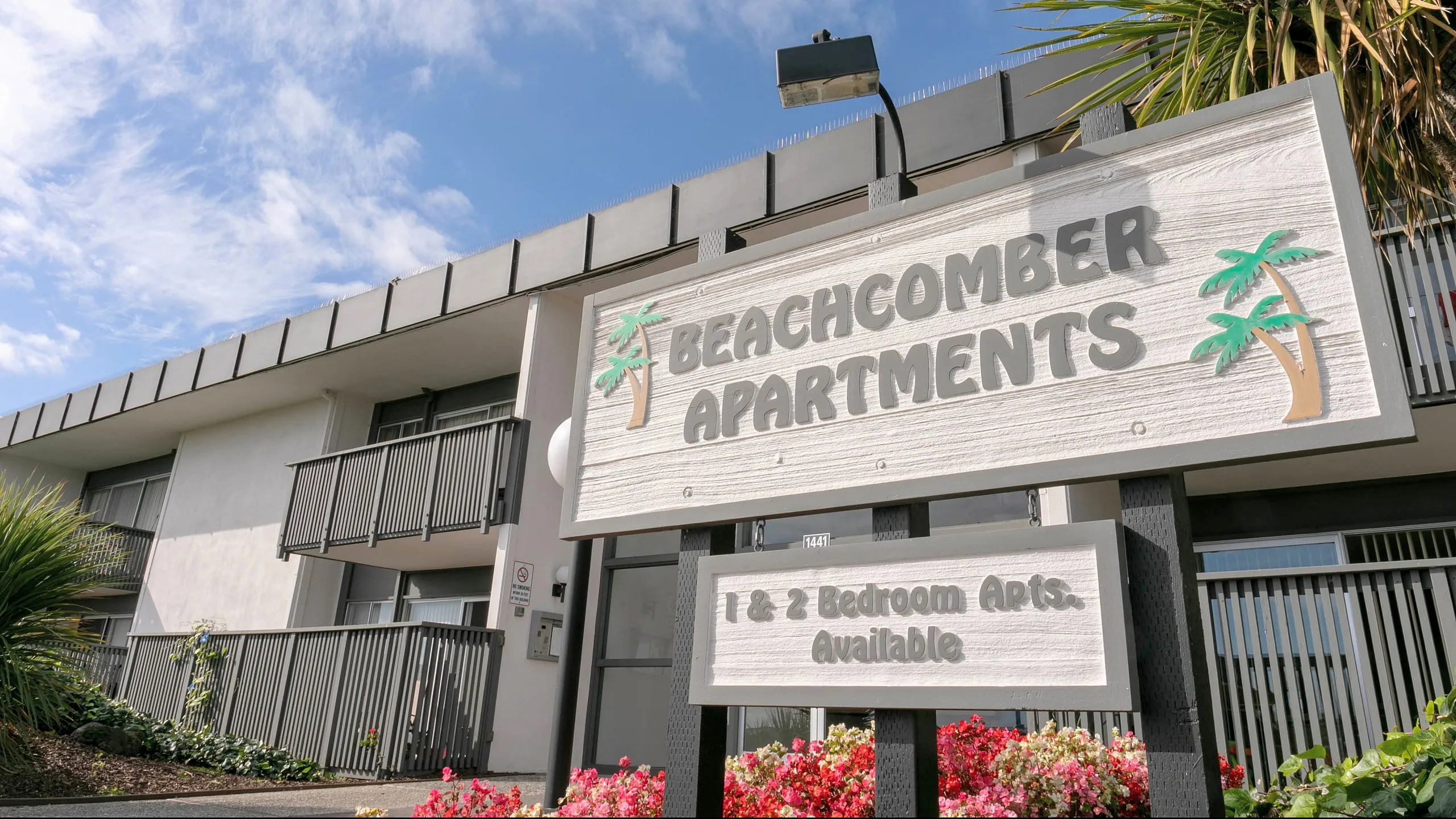 Building sign at Beachcomber Apartments