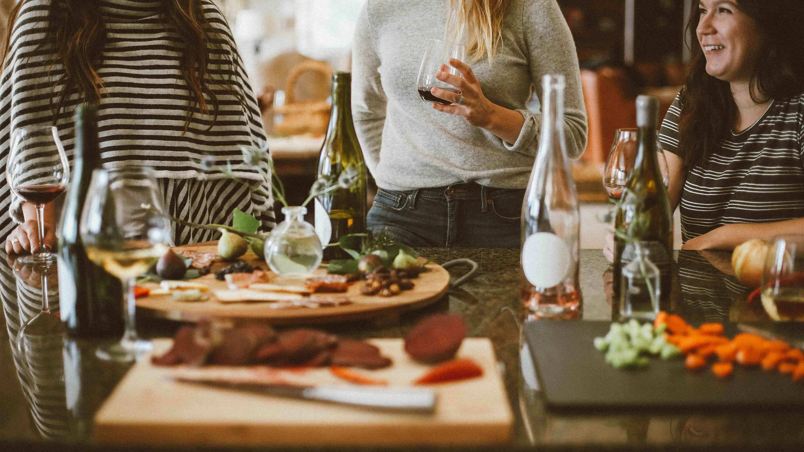 Group of friends having wine and appetizers