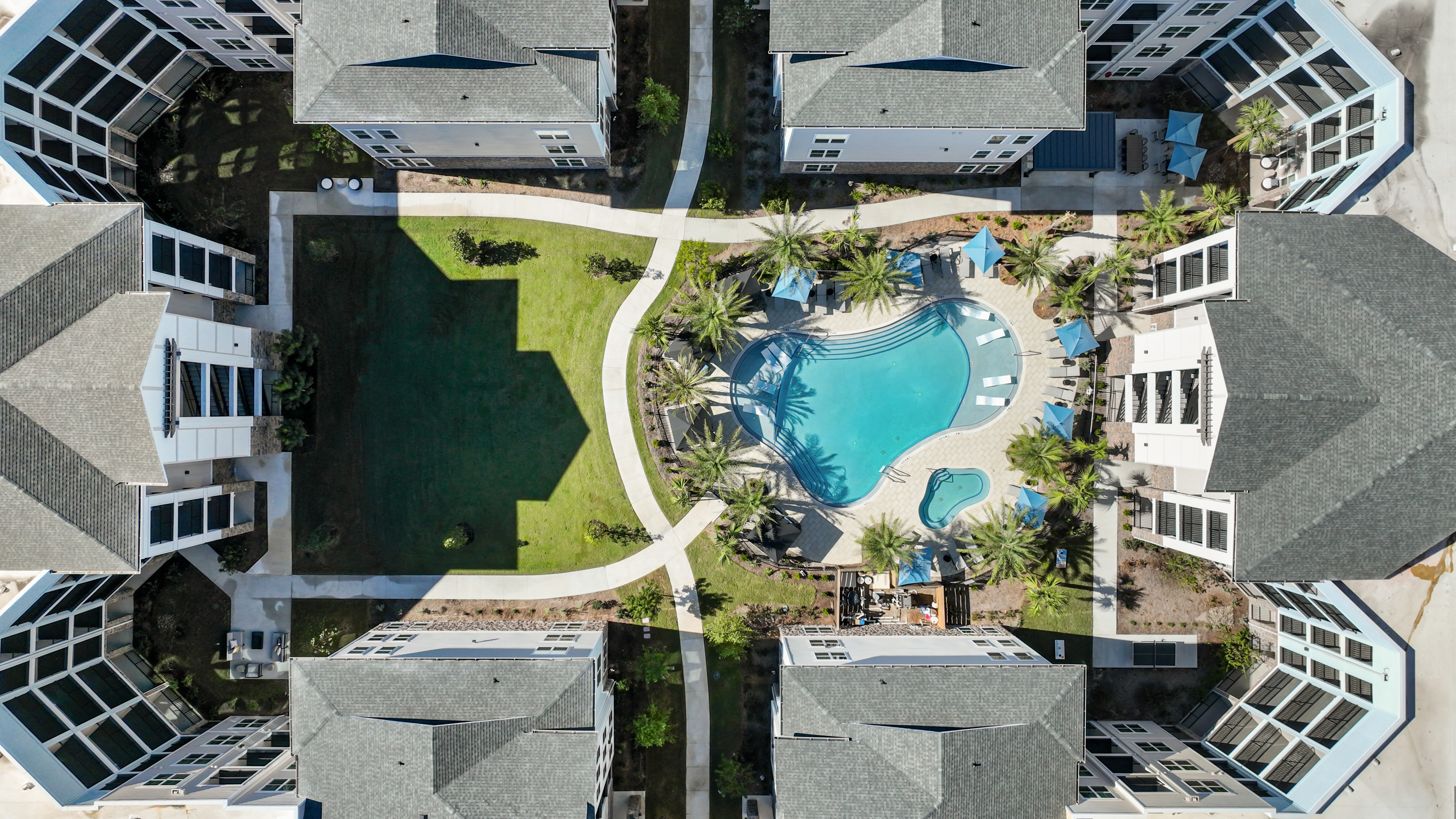 Resort-inspired pool w/ sun-shelf & cabanas