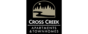 Cross Creek Apartments and Townhomes featuring a scenic landscape silhouette with trees and a creek under a moonlit sky.