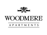 Elegant emblem of Woodmere Apartments with classic and sophisticated design.