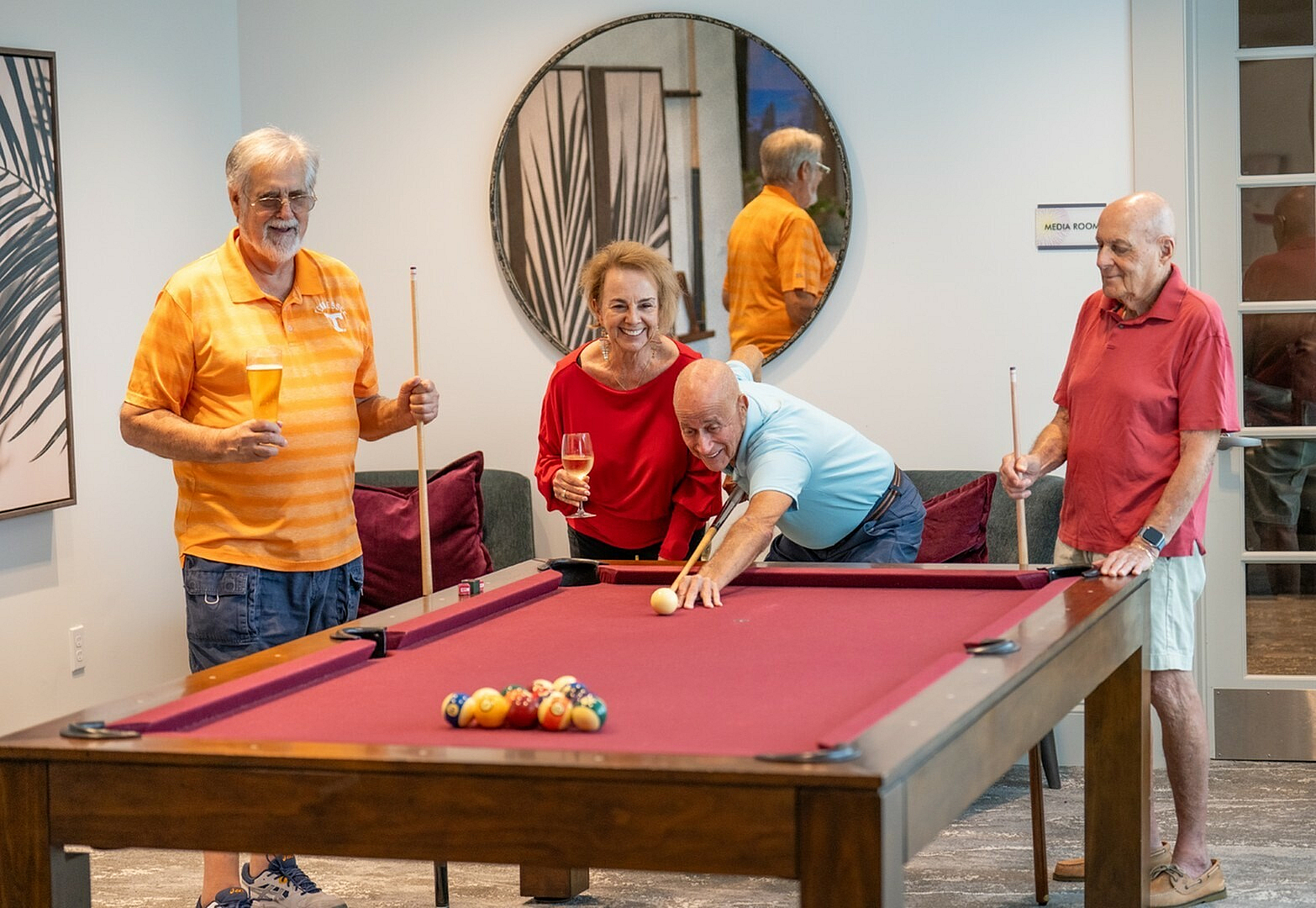 Arcadia Gardens seniors playing pool with friends