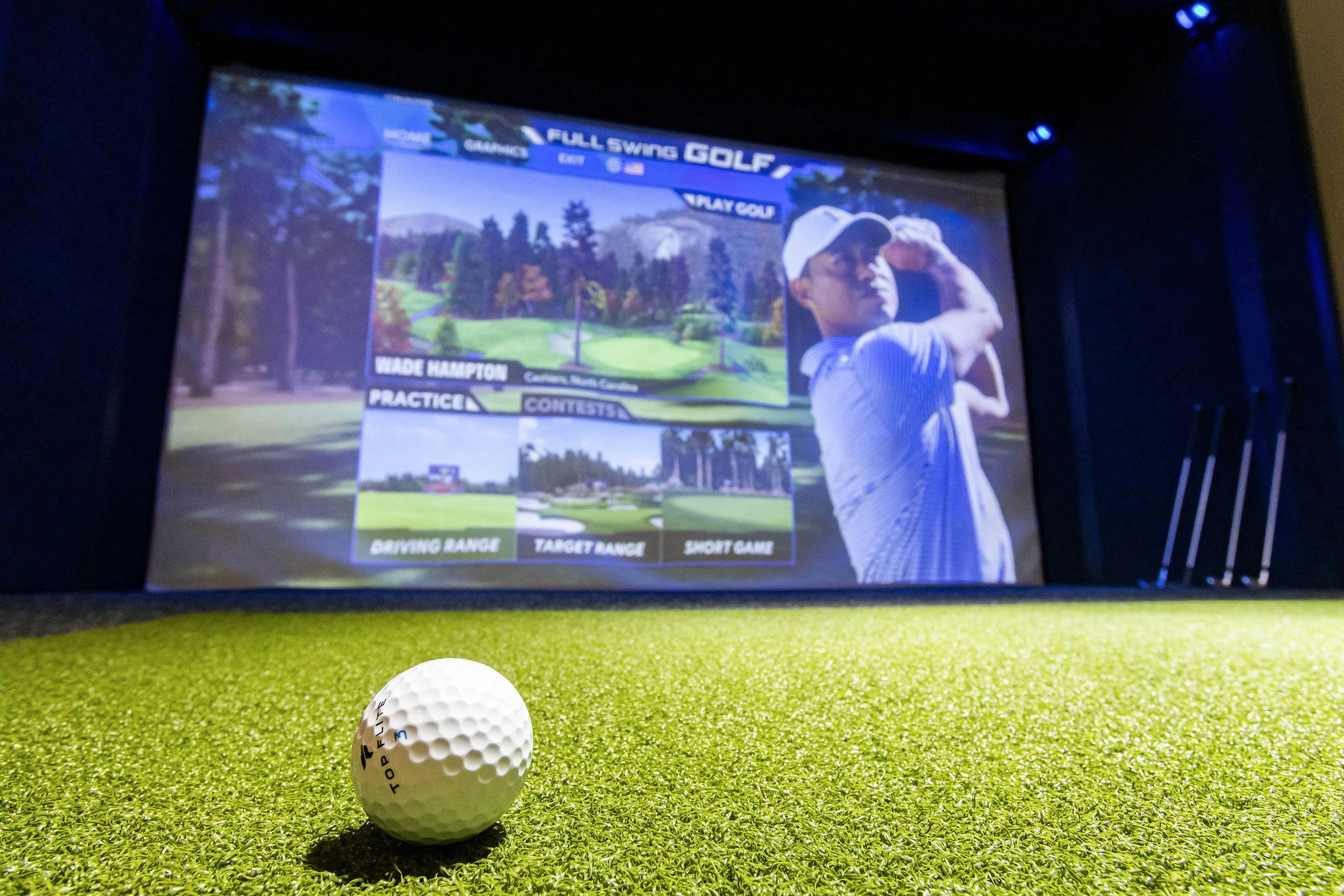 Immersive indoor golf simulator with realistic course visuals, perfect for honing your swing in luxury.