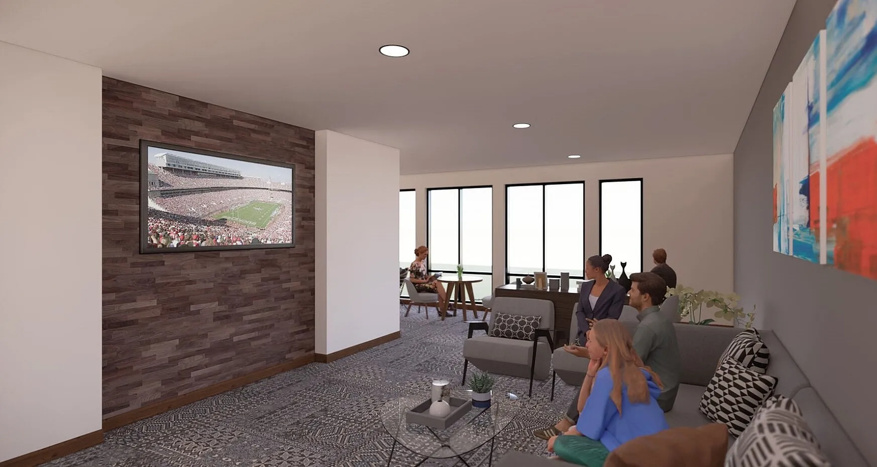 Modern living room with sleek decor, comfortable seating, and large windows providing natural light. Features a stylish gallery wall, a flat-screen TV, and a cozy atmosphere for relaxation.